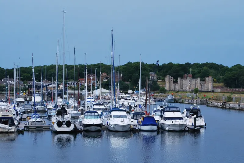 Yachts moored in Chatham Maritime Marina, with Upnor Castle and wooded shore across the River Medway