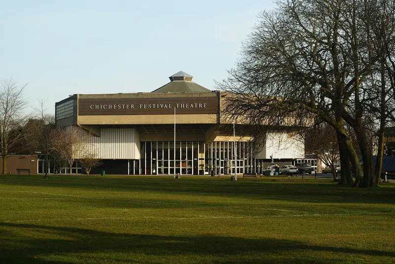 The angular 1960s Chichester Festival Theatre beside the lawns of Oaklands Park