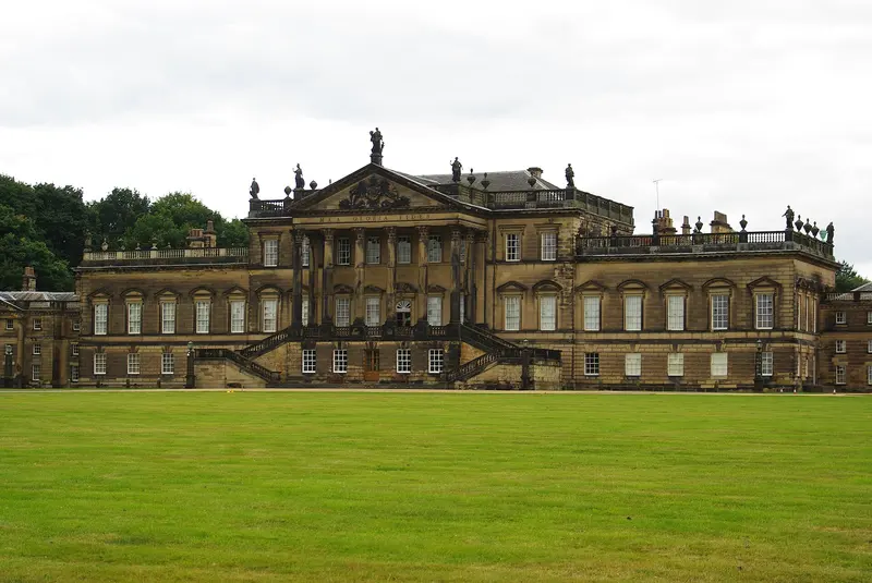 The vast Georgian front of Wentworth Woodhouse beyond a wide green lawn